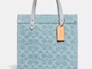 コーチメスのシグネチャー デニムのバッグ